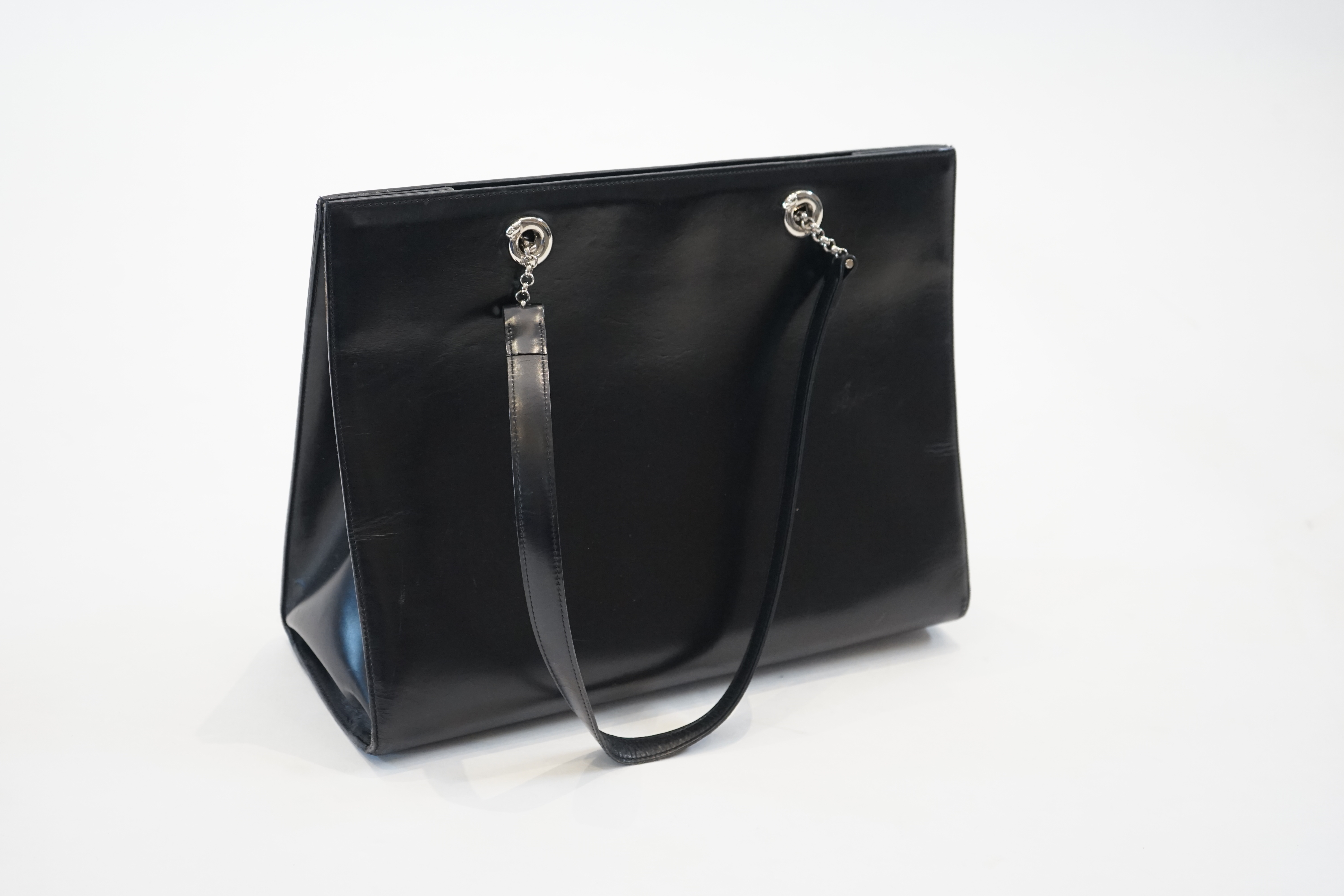 A Cartier Panthère shopping bag in black leather, width 37cm, depth 13cm, height 28cm